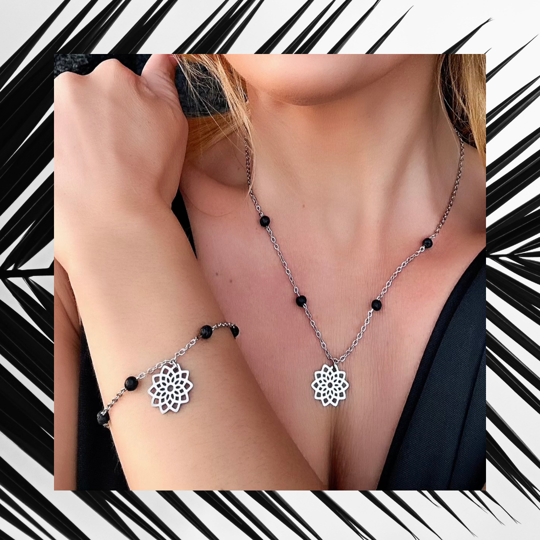 Exclusive Raw Lava Love Set by Infinity Muse Jewelry This exclusive necklace and bracelet set from Infinity Muse Jewelry combines modern minimalism with the raw energy of the earth. Each piece of jewelry can be purchased individually or as a complete set. Discover the exquisite combination of premium surgical steel and the raw energy of 4 mm natural lava stones, available in two variants — deep black or pure white.