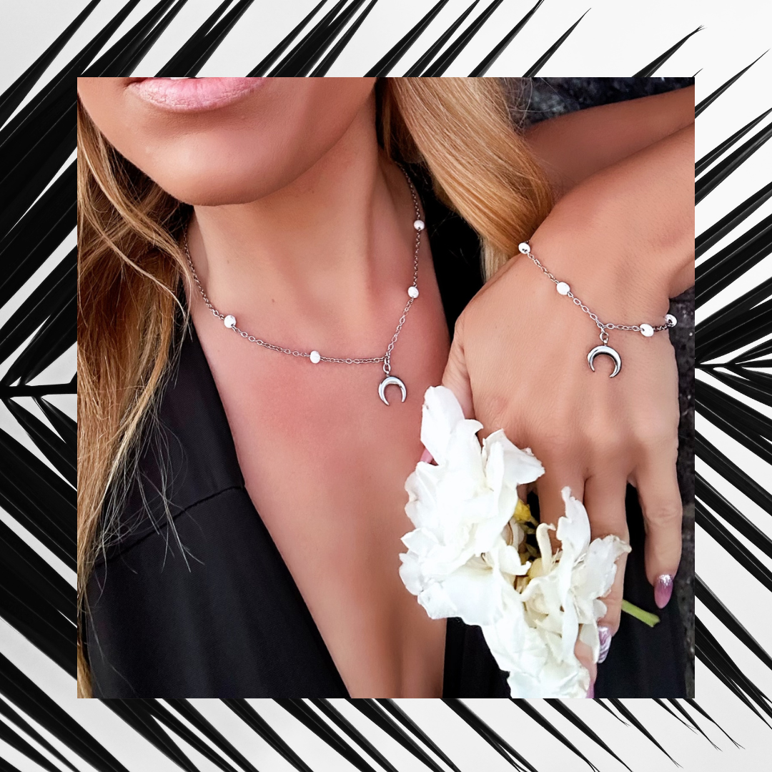 Exclusive Raw Lava Love Set by Infinity Muse Jewelry This exclusive necklace and bracelet set from Infinity Muse Jewelry combines modern minimalism with the raw energy of the earth. Each piece of jewelry can be purchased individually or as a complete set. Discover the exquisite combination of premium surgical steel and the raw energy of 4 mm natural lava stones, available in two variants — deep black or pure white.
