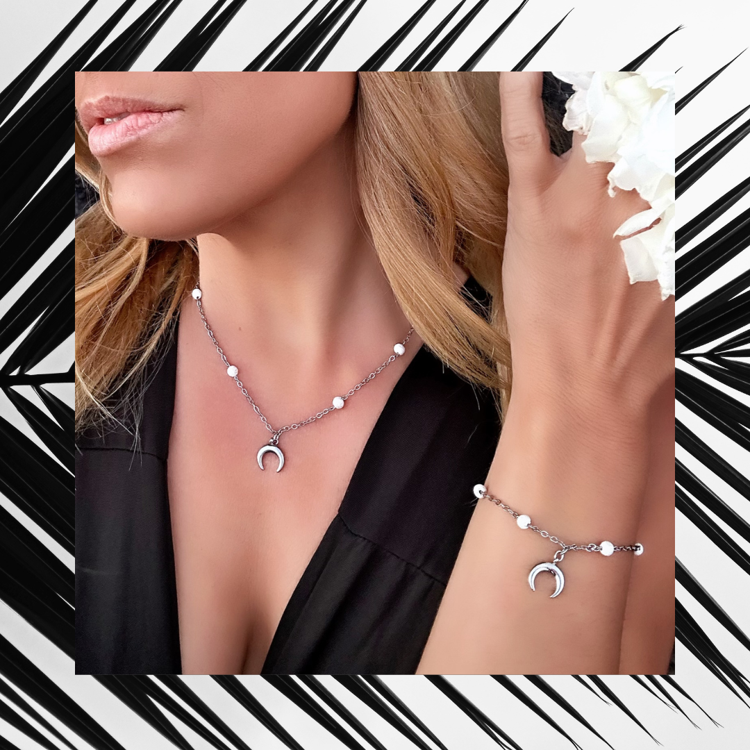 Exclusive Raw Lava Love Set by Infinity Muse Jewelry This exclusive necklace and bracelet set from Infinity Muse Jewelry combines modern minimalism with the raw energy of the earth. Each piece of jewelry can be purchased individually or as a complete set. Discover the exquisite combination of premium surgical steel and the raw energy of 4 mm natural lava stones, available in two variants — deep black or pure white.